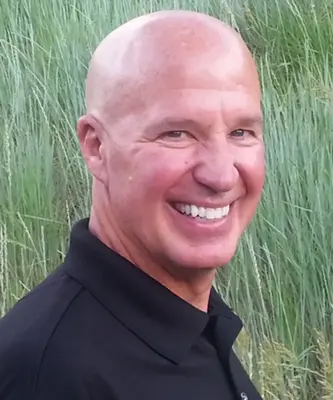 Portrait of John Travis, Associate Broker